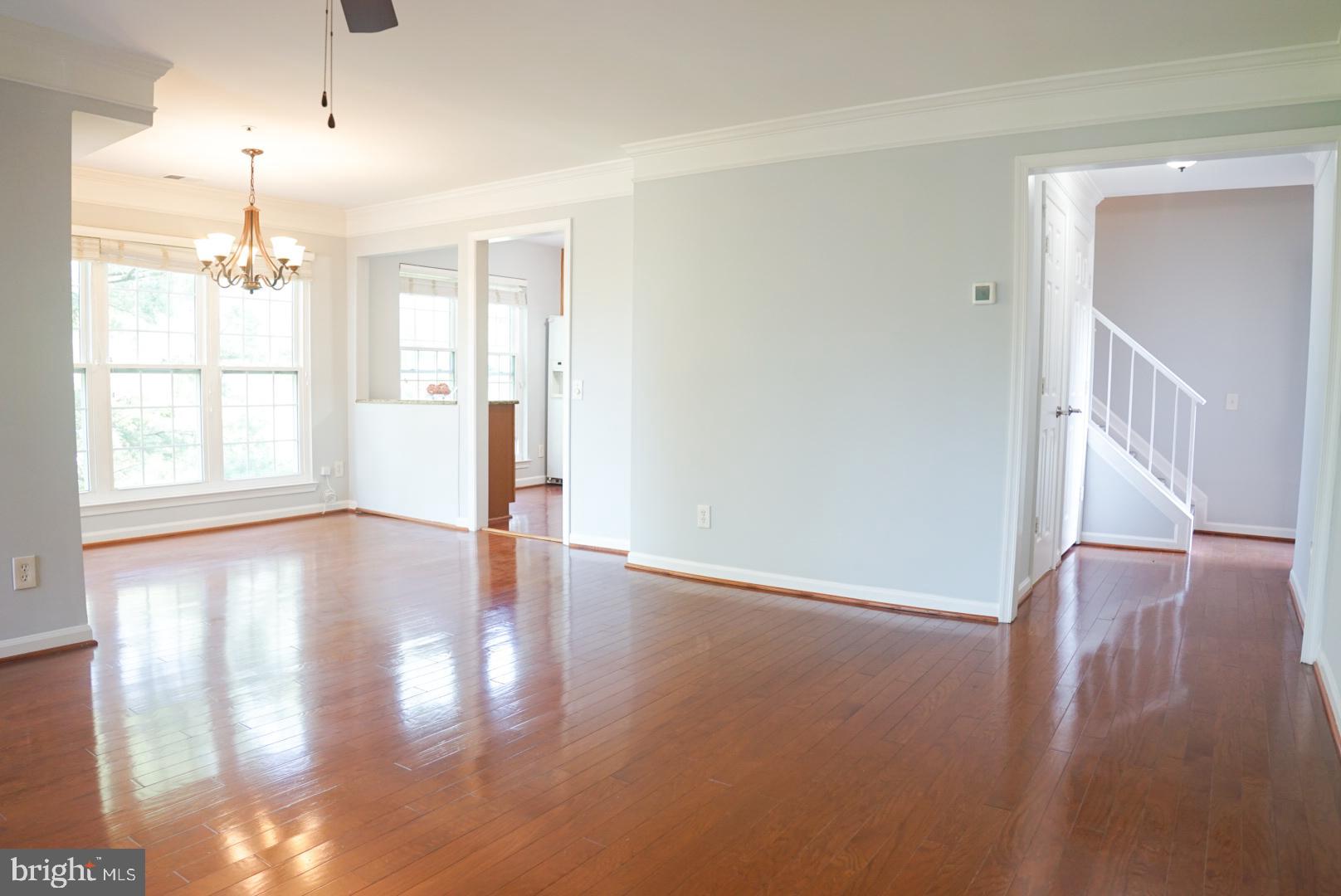 2816 Emma Lee Street, Unit 301 Falls Church, VA 22042 - Photo 11 of 45 a view of an empty room with wooden floor and a window