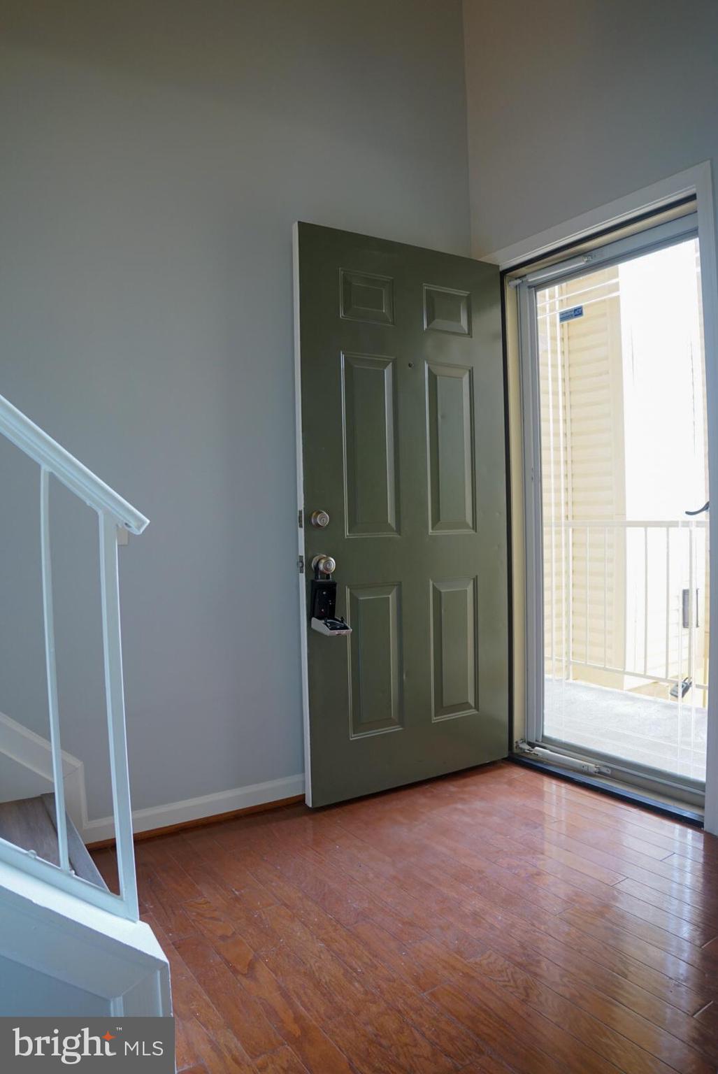 2816 Emma Lee Street, Unit 301 Falls Church, VA 22042 - Photo 8 of 45 an empty room with wooden floor and windows