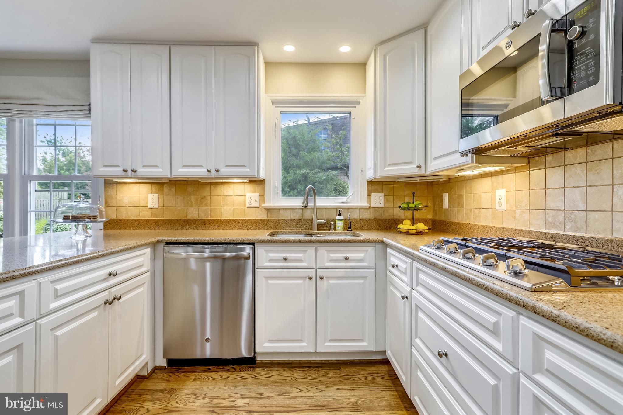 1721 Stonebridge Road Alexandria, VA 22304 - Photo 17 of 62 White cabinets, granite counters & hardwood floors