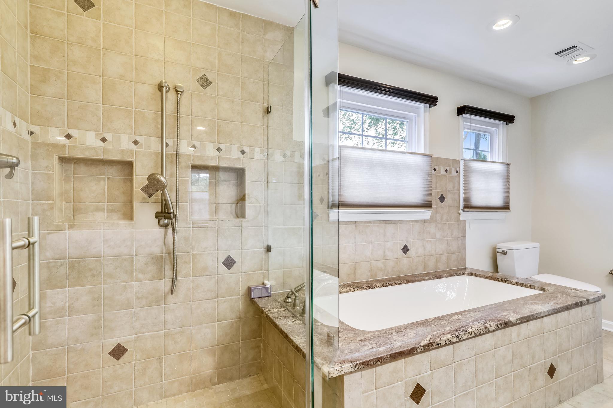 1721 Stonebridge Road Alexandria, VA 22304 - Photo 31 of 62 Owners' suite frameless glass, dual-head shower