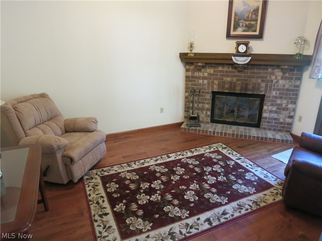 9105 North Marks Road Strongsville, OH 44149 - Photo 8 of 23 Den with gas fireplace. Engineered hardwood floors. Patio door out to back yard