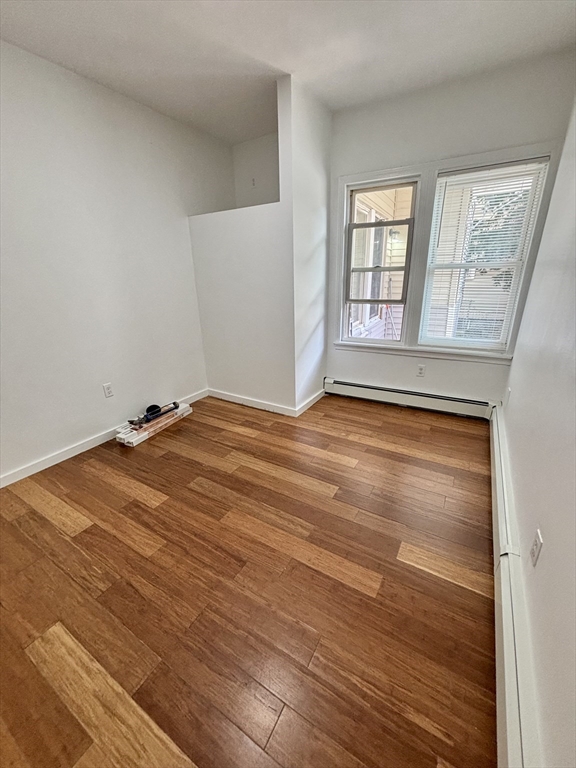 39 Shawmut Street, Unit 1 Chelsea, MA 02150 - Photo 8 of 13 a view of a room with wooden floor and windows