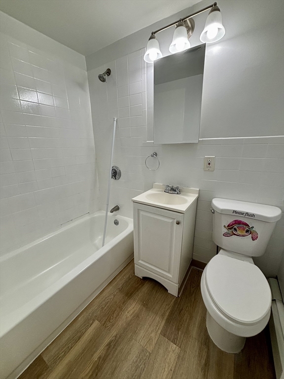39 Shawmut Street, Unit 1 Chelsea, MA 02150 - Photo 10 of 13 a bathroom with a sink a toilet and bathtub