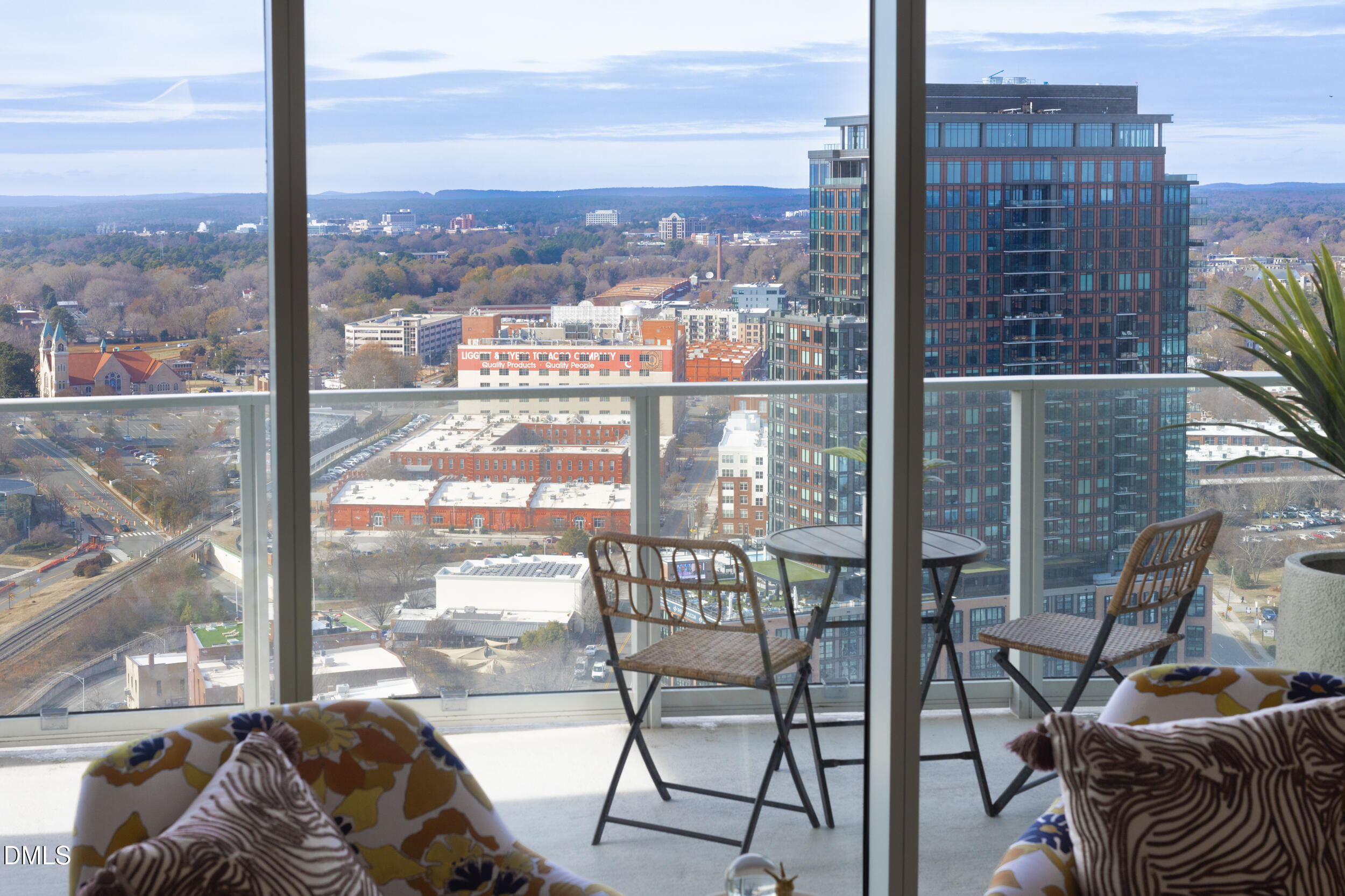 110 Corcoran Street, Unit 2502 Durham, NC 27701 - Photo 46 of 87 a view of a city from a roof deck with couches