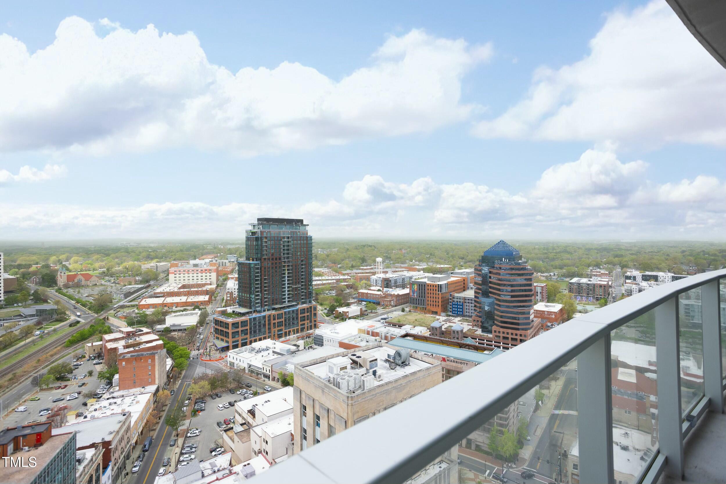 110 Corcoran Street, Unit 2502 Durham, NC 27701 - Photo 55 of 87 a view of a city skyline from a balcony