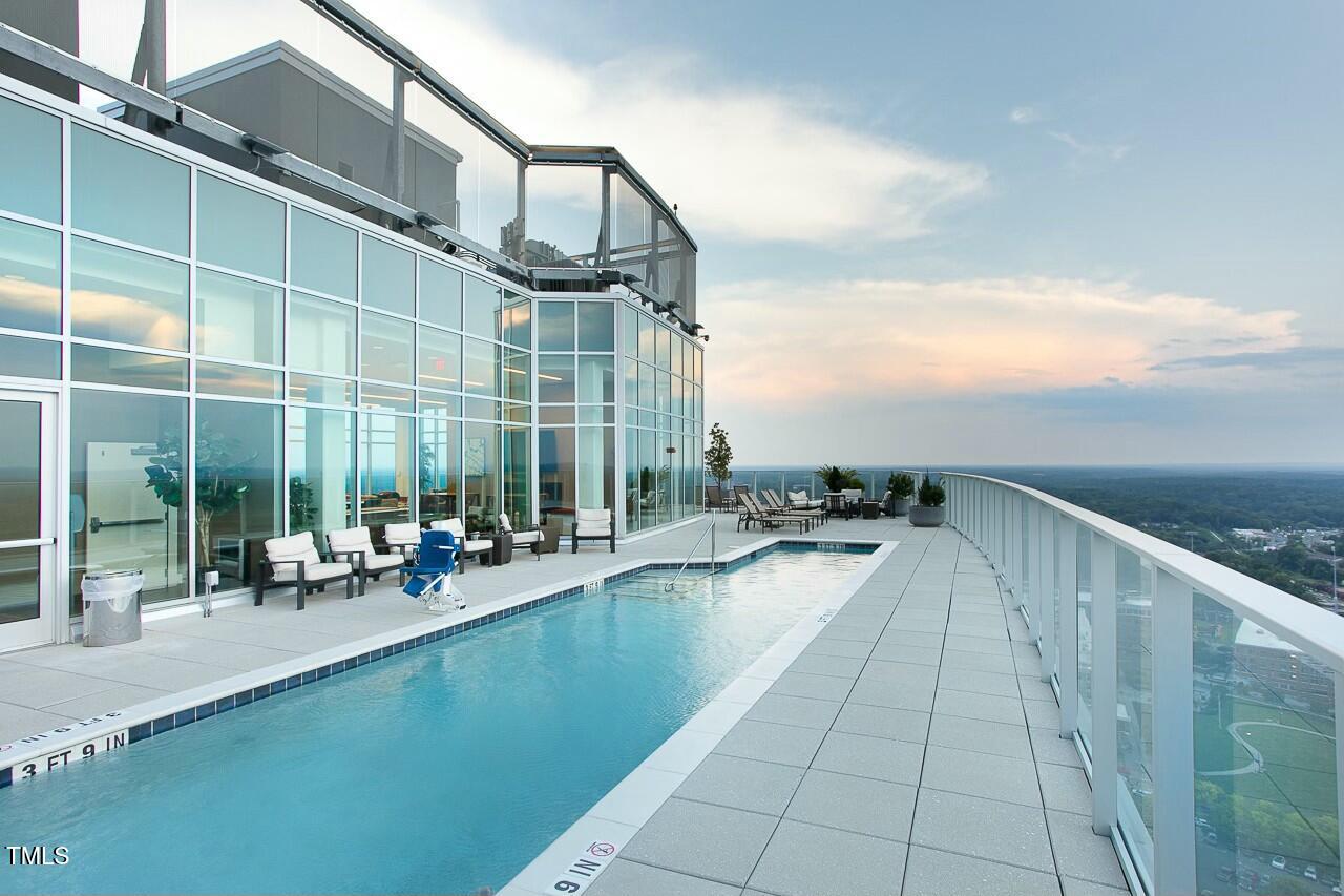 110 Corcoran Street, Unit 2502 Durham, NC 27701 - Photo 72 of 87 a view of swimming pool with outdoor seating and plants