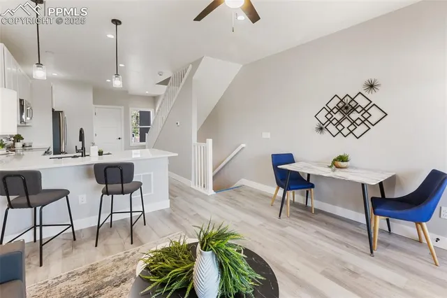 a kitchen with a refrigerator a sink and cabinets