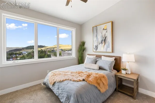 a bed room with a bed and a painting