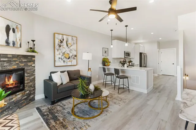 a view of living room with furniture and a chandelier