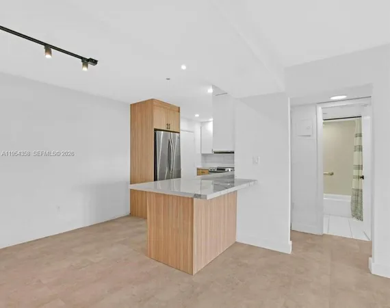a view of a kitchen with a sink