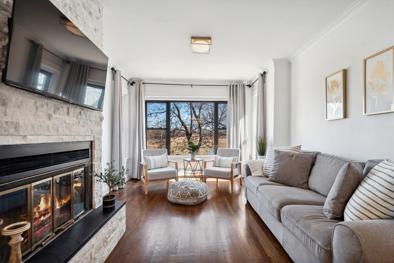5426 North Western Avenue, Unit 2 Chicago, IL 60625 - Photo 2 of 10 a living room with furniture and a fireplace