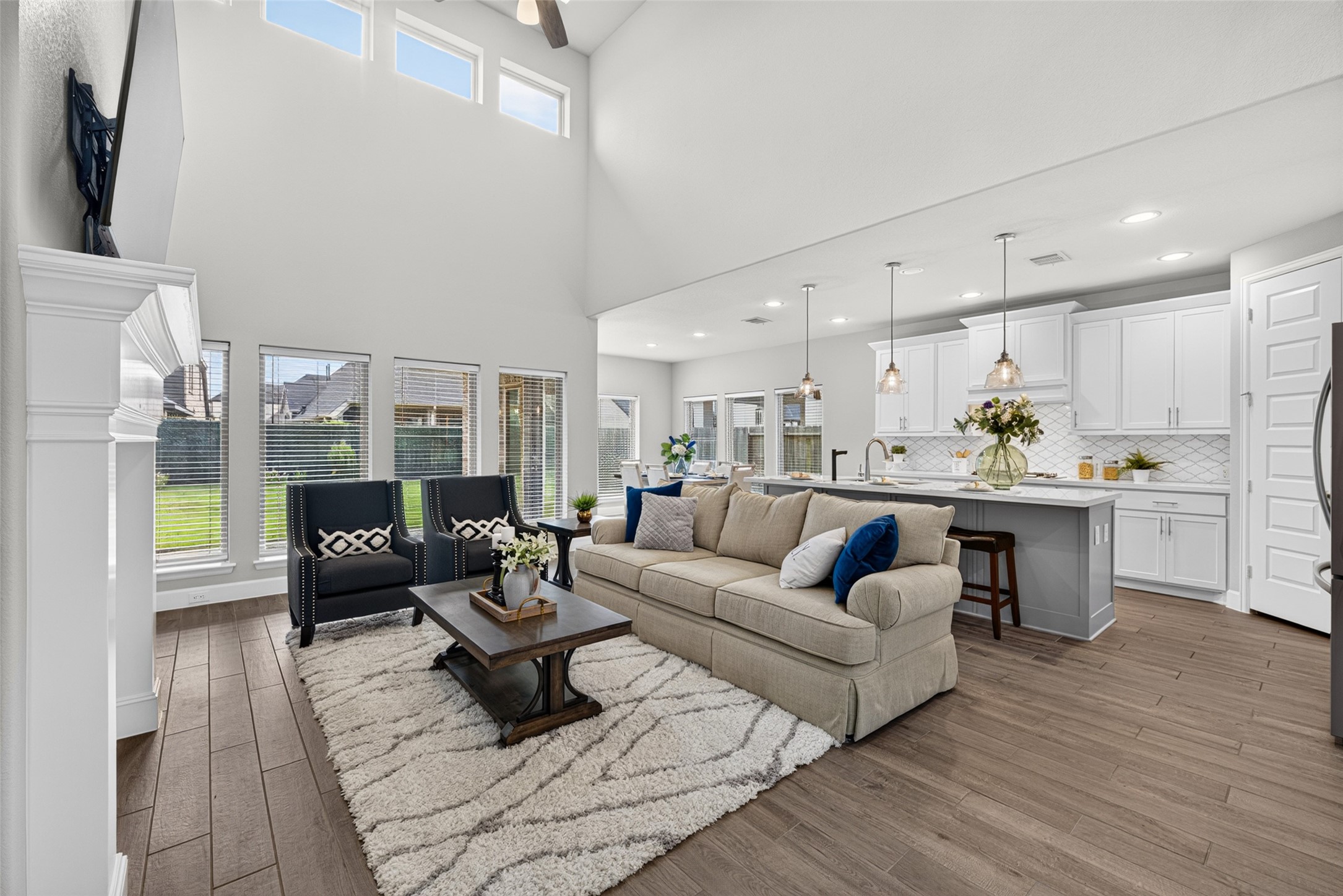 4207 Ana Ridge Lane Fulshear, TX 77441 - Photo 6 of 37 Bright, open-concept main floor seamlessly connecting the cozy living area and gourmet kitchen—the perfect layout for keeping the whole family connected!