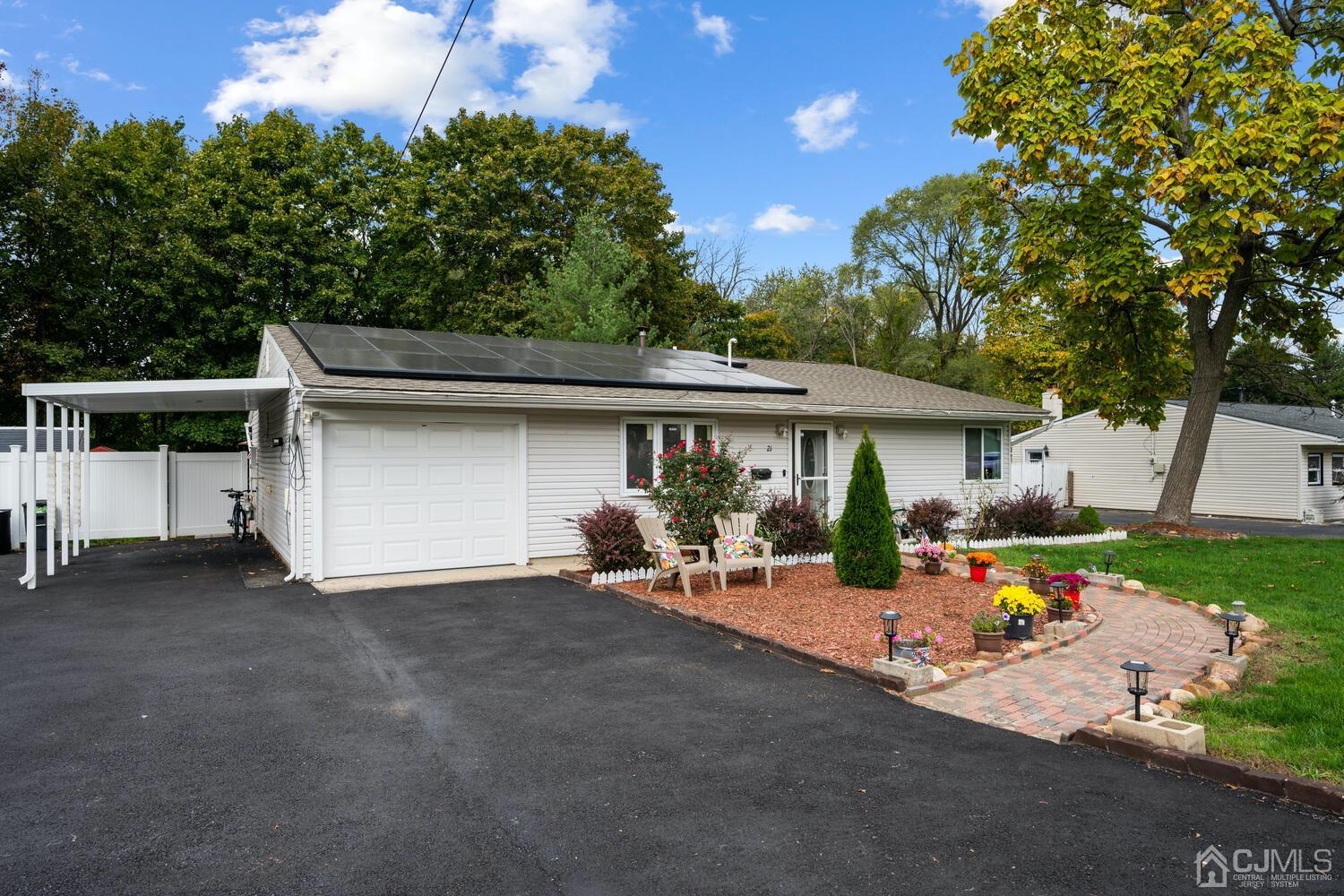 21 Kingsley Road Kendall Park, NJ 08824 - Photo 4 of 29 front view of a house with a patio