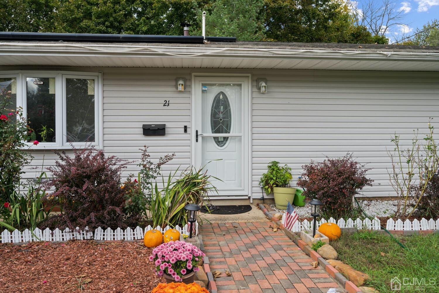 21 Kingsley Road Kendall Park, NJ 08824 - Photo 5 of 29 a potted plant sitting in front of a window