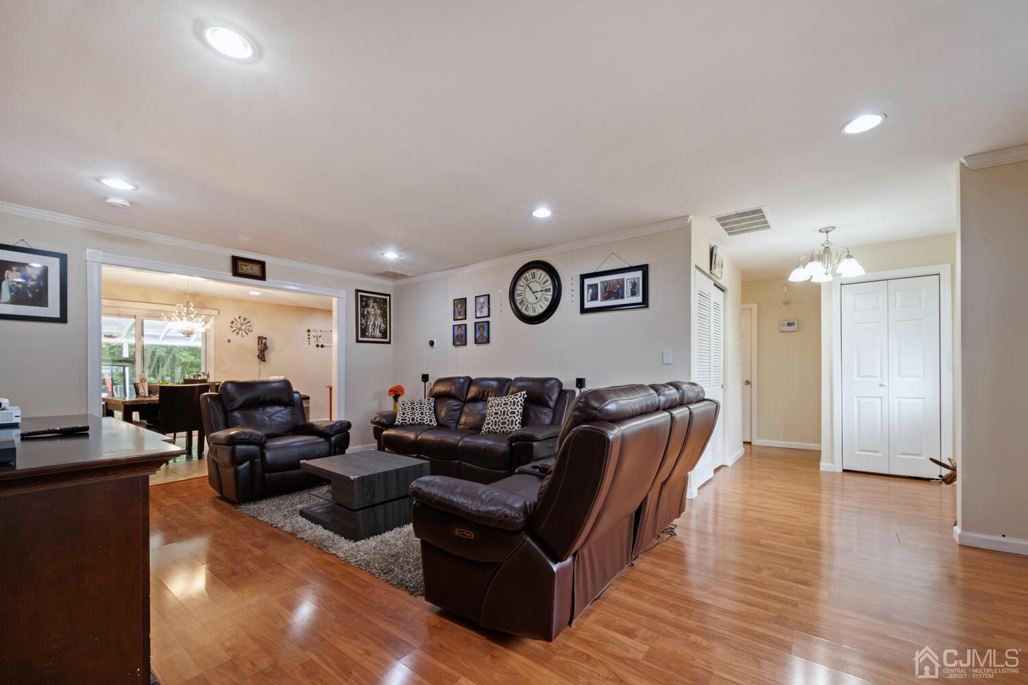 21 Kingsley Road Kendall Park, NJ 08824 - Photo 8 of 29 a living room with furniture and wooden floor
