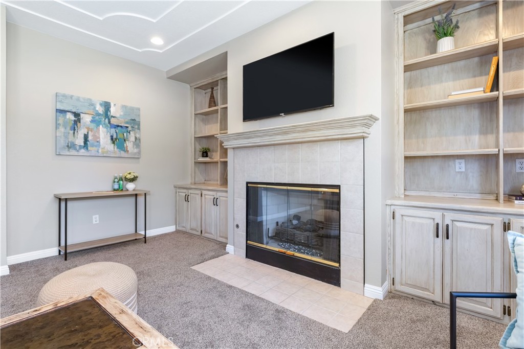 1275 Shane Lane Templeton, CA 93465 - Photo 29 of 70 a living room with furniture a flat screen tv and a fireplace