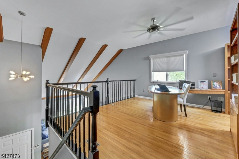 100 Easedale Road, Unit 100 Wayne, NJ 07470 - Photo 30 of 43 a view of a dining room with furniture and a chandelier