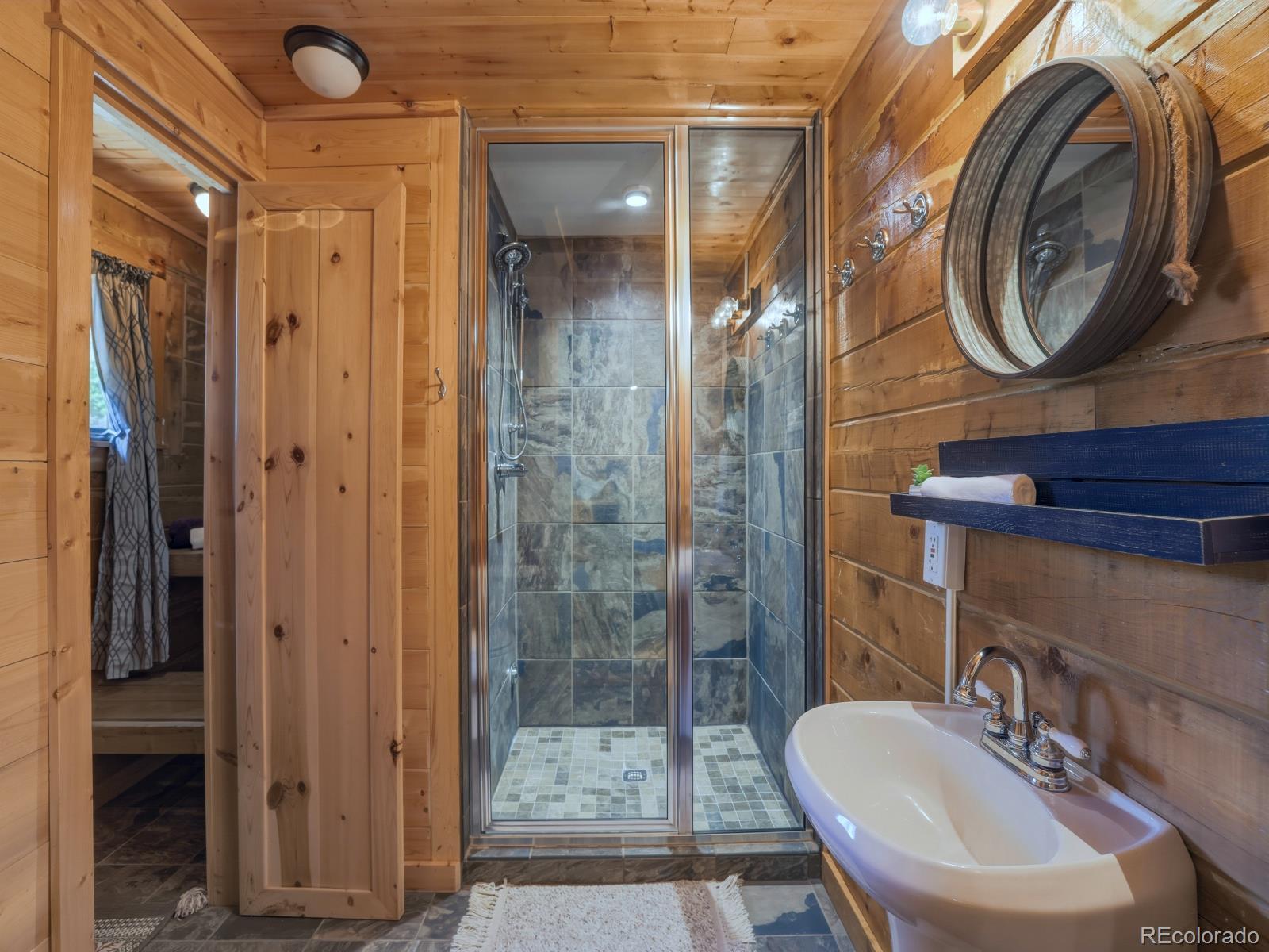 341 Anderson Road Walden, CO 80480 - Photo 16 of 50 a bathroom with a sink a toilet and shower