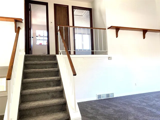 a view of staircase with large window