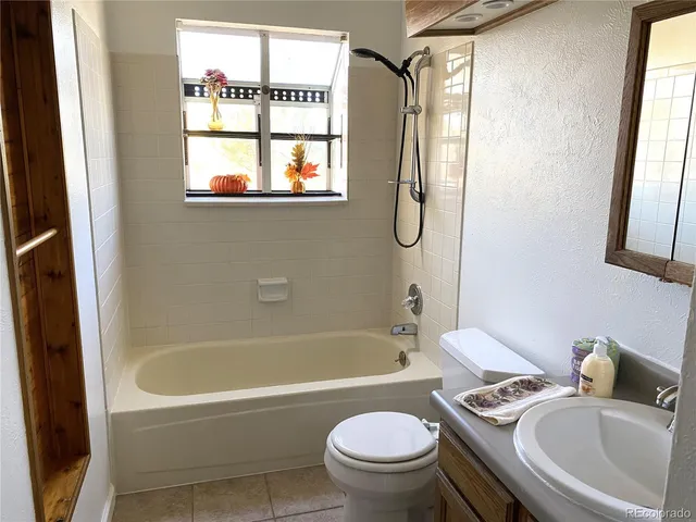 a bathroom with a sink toilet and bathtub