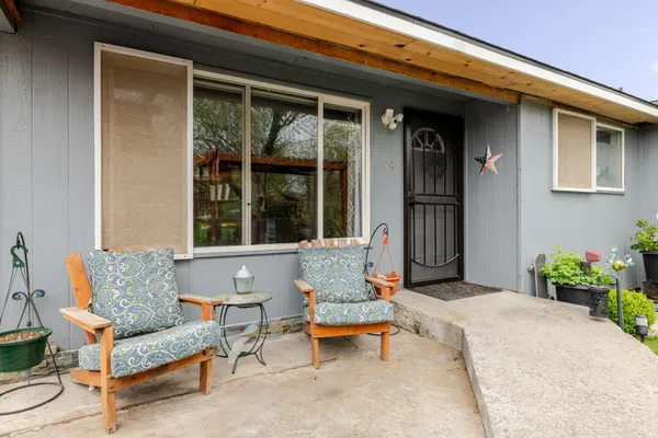 a outdoor living space with patio furniture and a window
