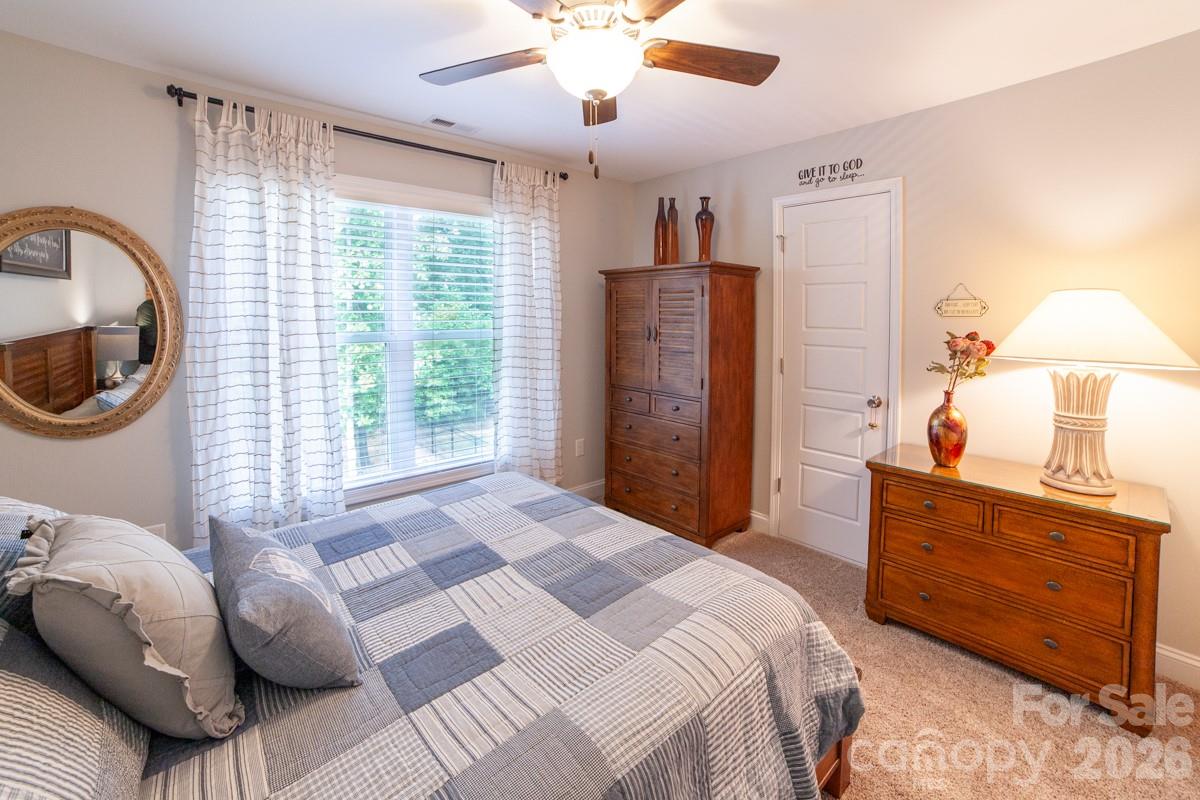 790 Brandon Road Clover, SC 29710 - Photo 31 of 43 a bedroom with a bed and a chandelier