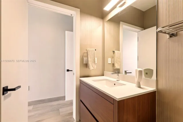 a bathroom with a sink and a mirror