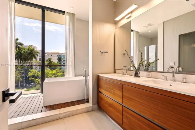 a spacious bathroom with a double vanity sink and a mirror