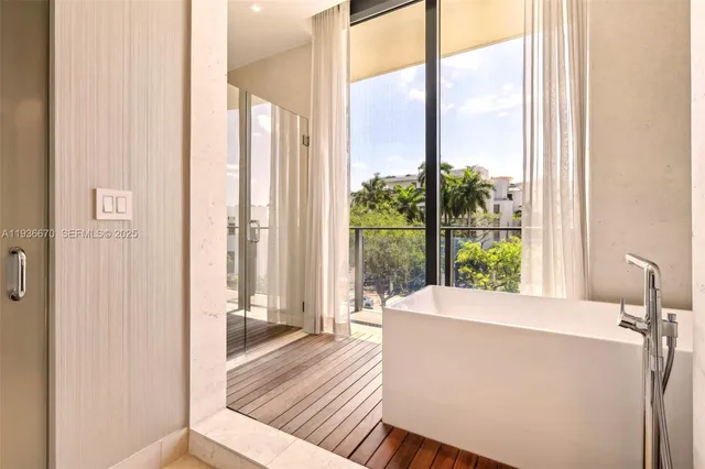 a living room with a large window and a table