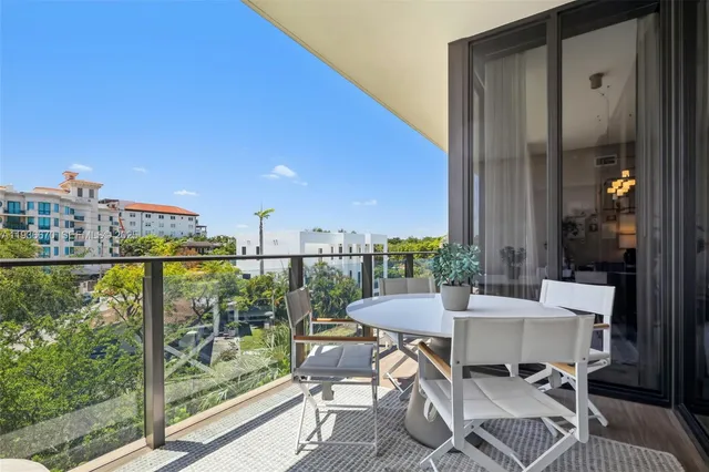 a outdoor view with a sitting space and large windows