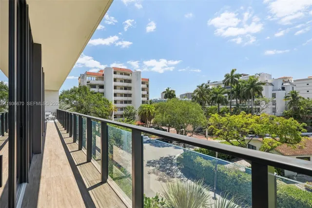 a view of a balcony with wooden floor
