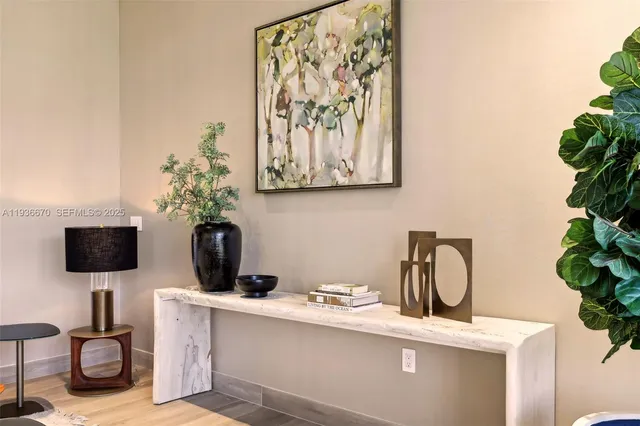 a view of a room with a potted plant on a sink