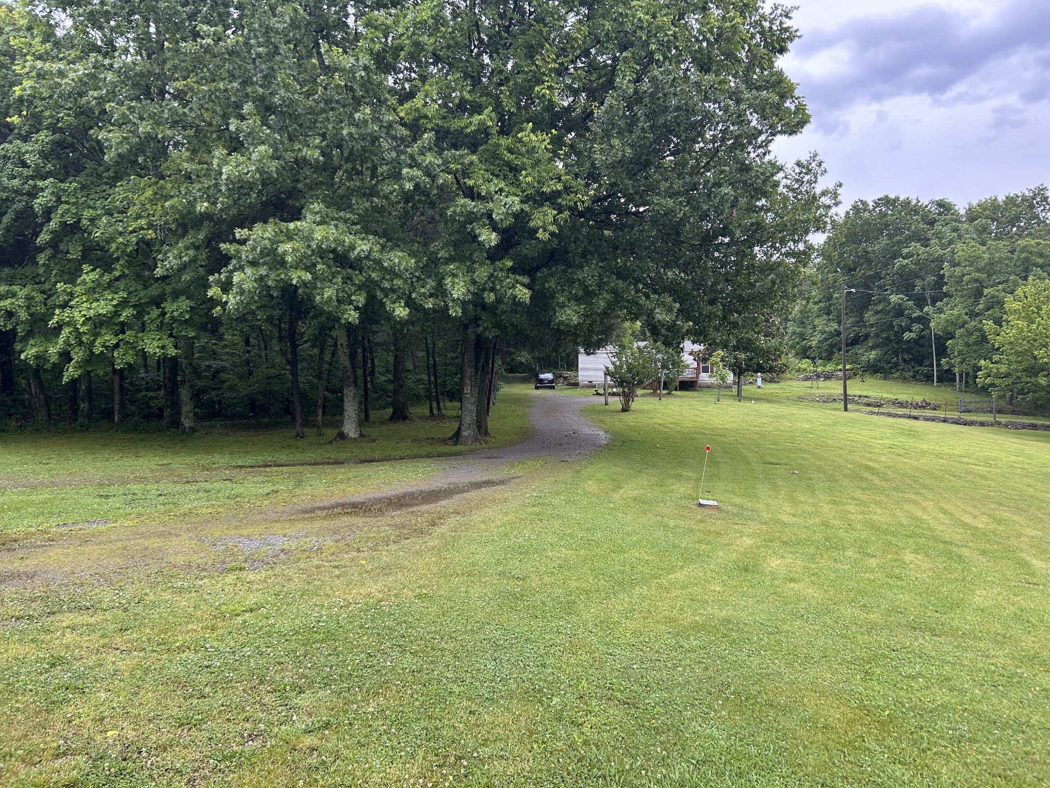 9780 Spanntown Road Arrington, TN 37014 - Photo 5 of 5 a view of a swimming pool with a yard and large trees