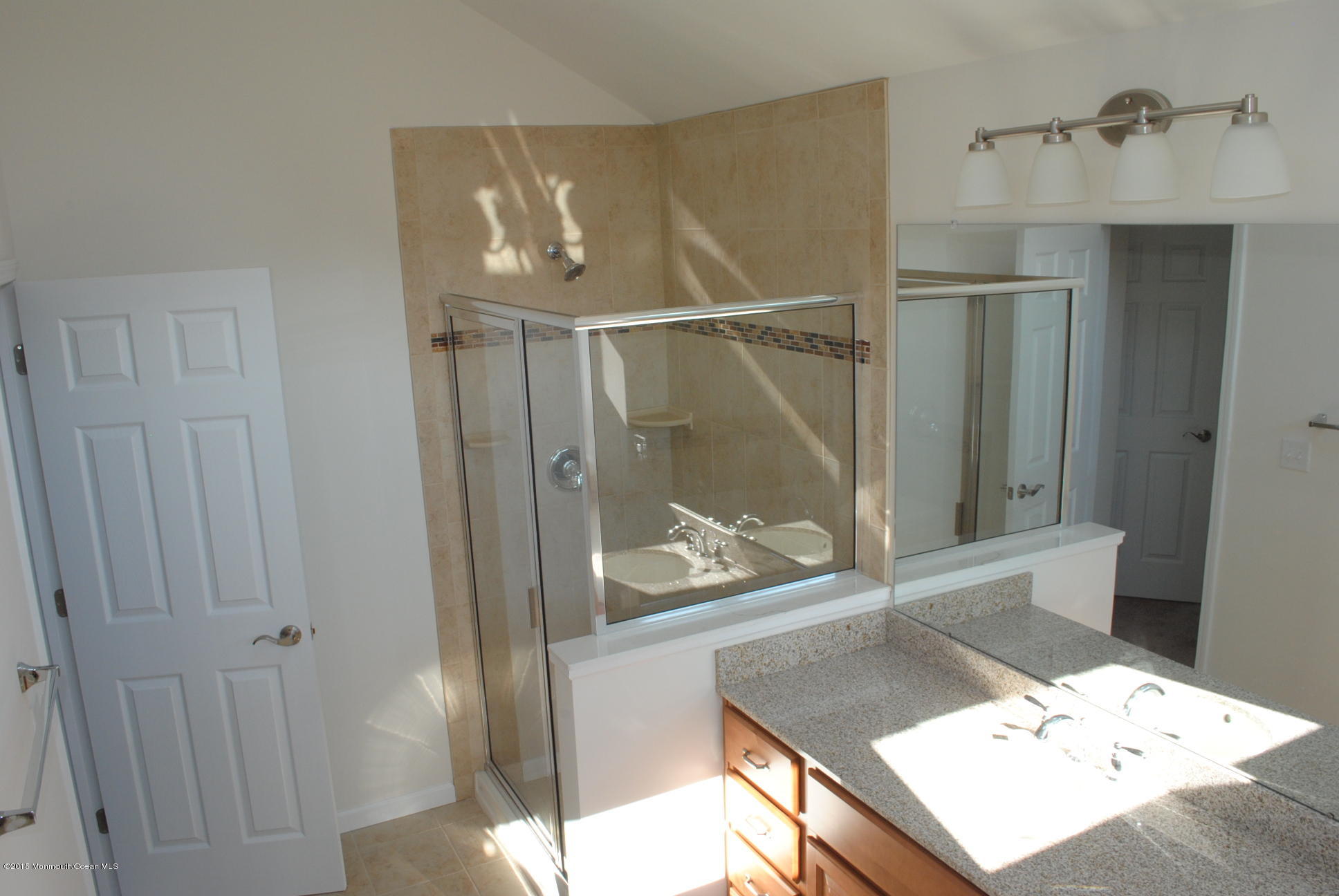 21 Bobstay Road Barnegat, NJ 08005 - Photo 14 of 17 a bathroom with a shower sink and mirror