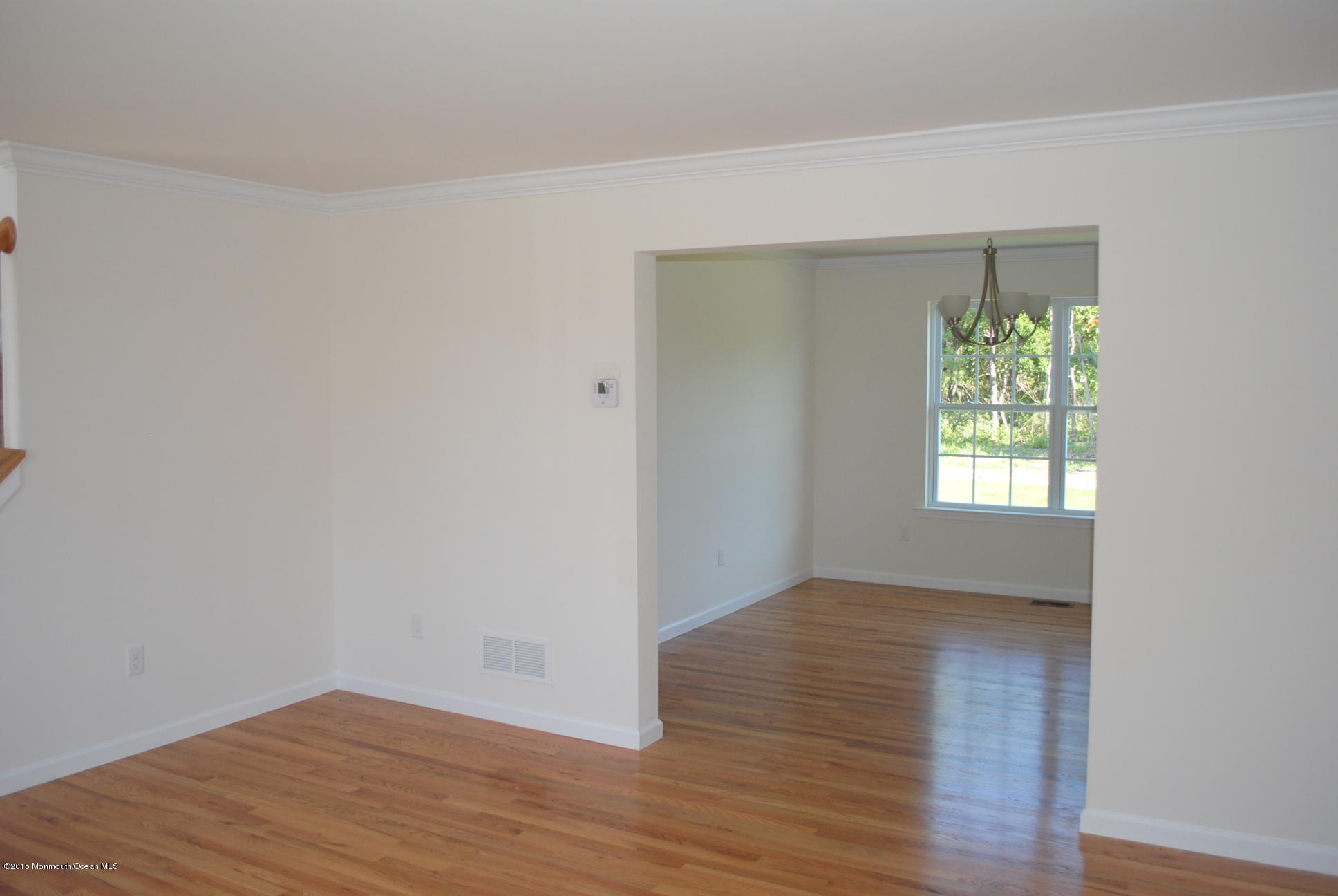 21 Bobstay Road Barnegat, NJ 08005 - Photo 7 of 17 a view of an empty room with wooden floor and a window