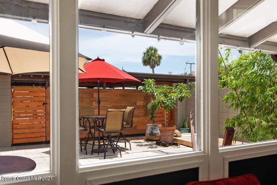 907 Santa Cruz Road Cocoa Beach, FL 32931 - Photo 13 of 30 a view of a outdoor space with seating area