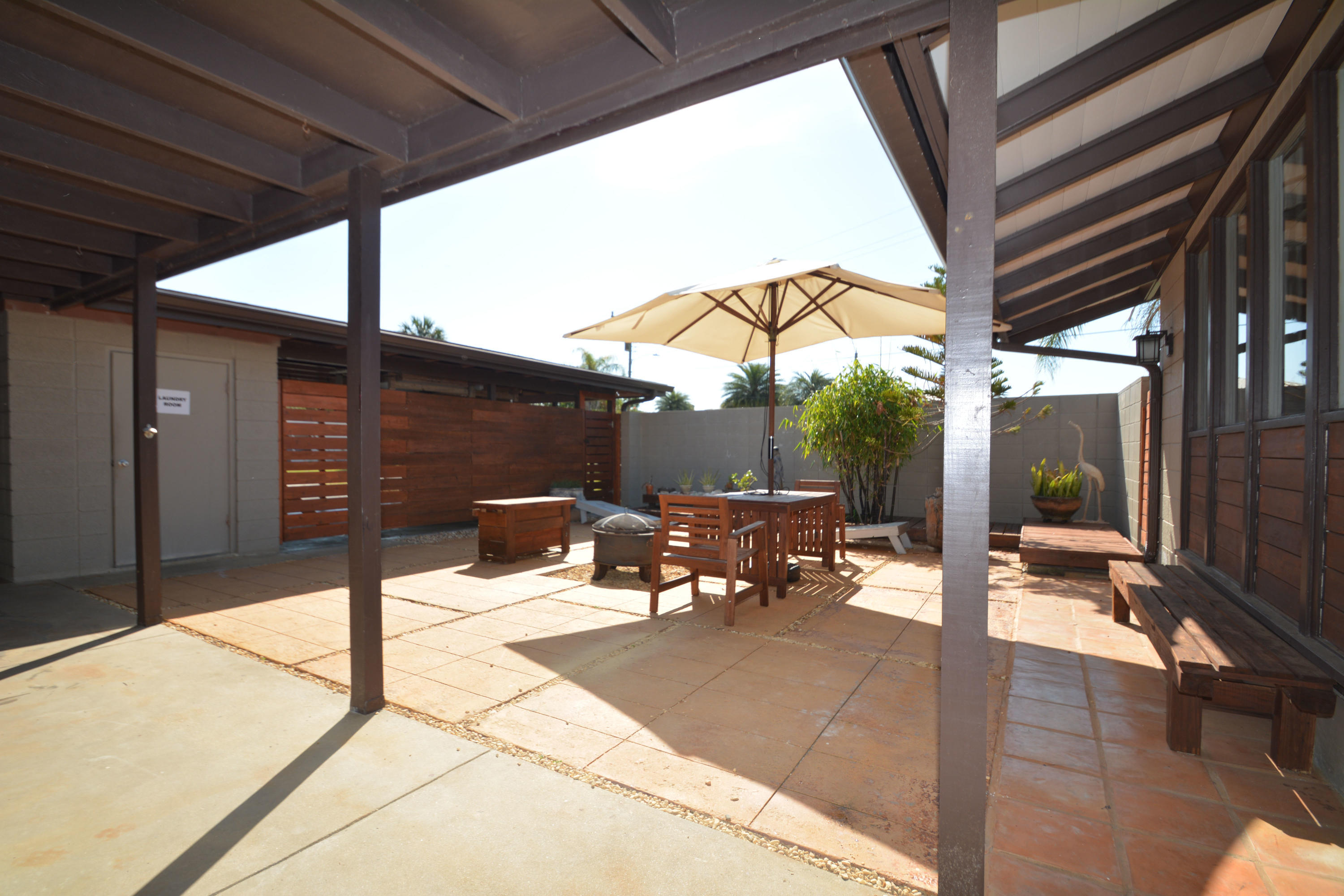 907 Santa Cruz Road Cocoa Beach, FL 32931 - Photo 23 of 30 a outdoor space with patio the couches and dining table with chairs