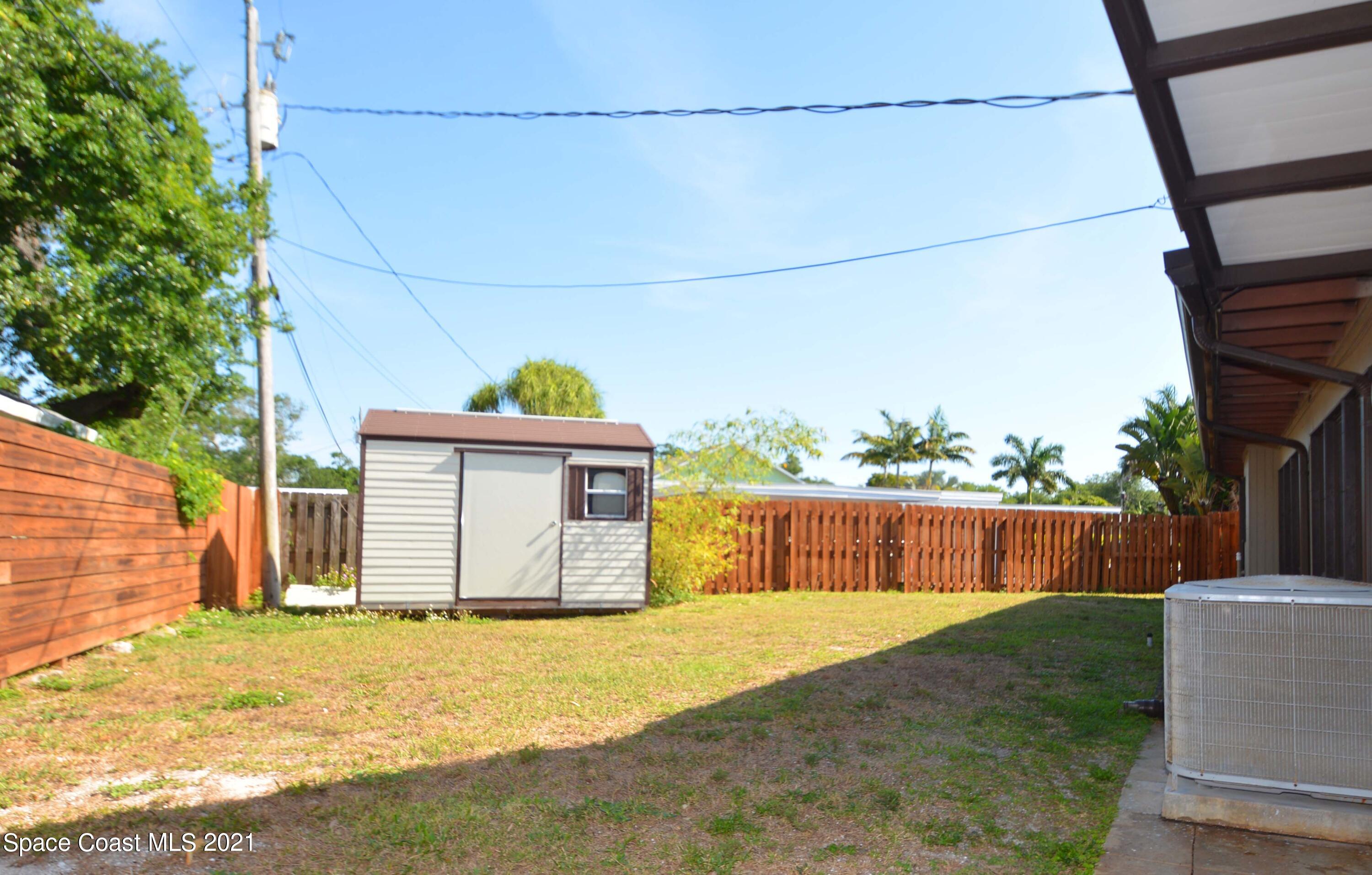 907 Santa Cruz Road Cocoa Beach, FL 32931 - Photo 25 of 30 a view of a backyard