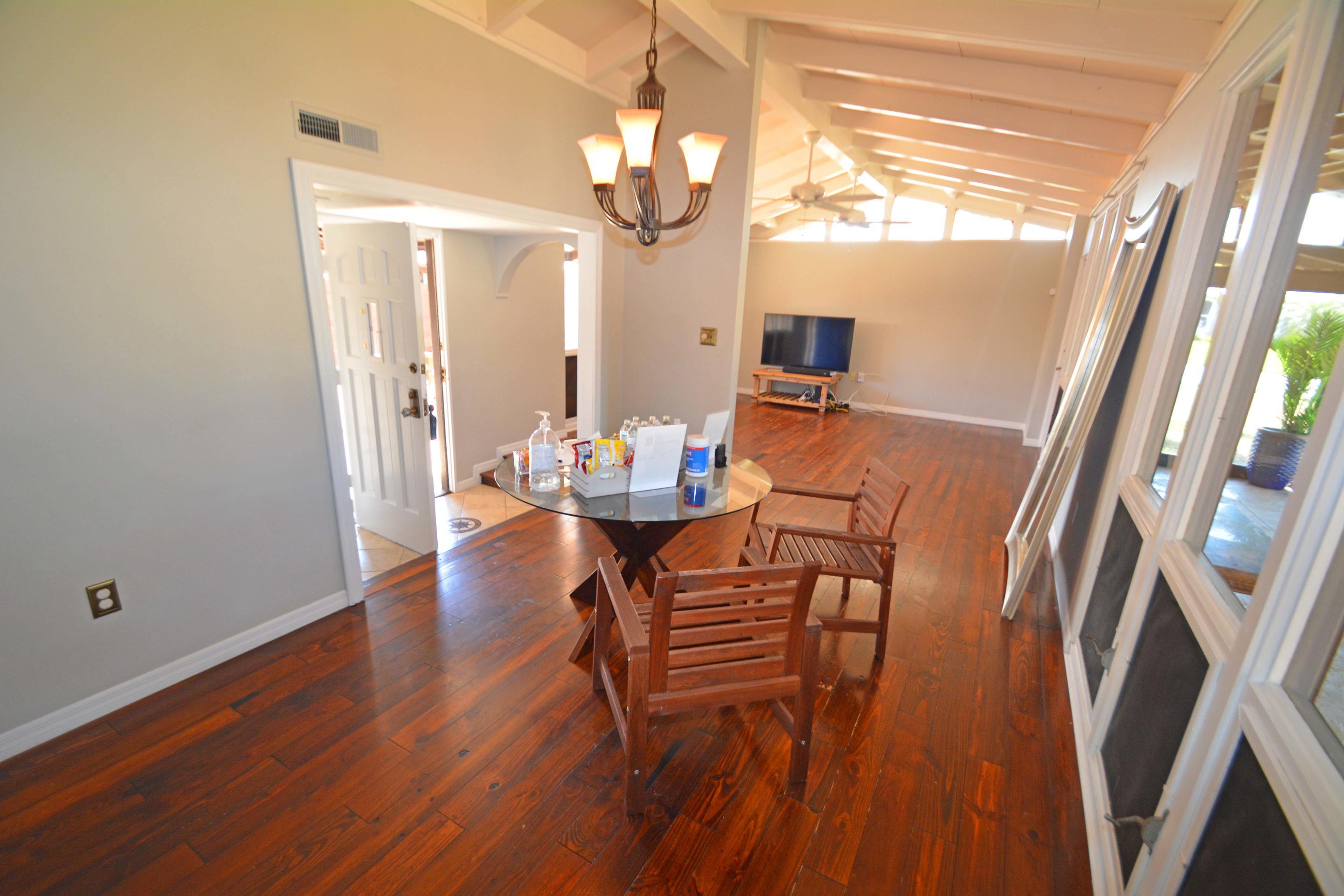 907 Santa Cruz Road Cocoa Beach, FL 32931 - Photo 5 of 30 a view of a dining room with furniture and wooden floor