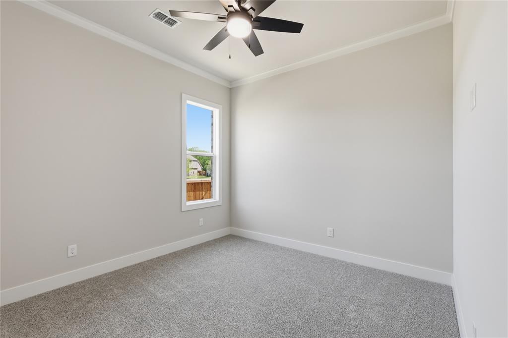 713 Anne Road Van Alstyne, TX 75495 - Photo 20 of 29 Carpeted room featuring a single window, a ceiling fan with integrated lighting, white baseboards, and crown molding