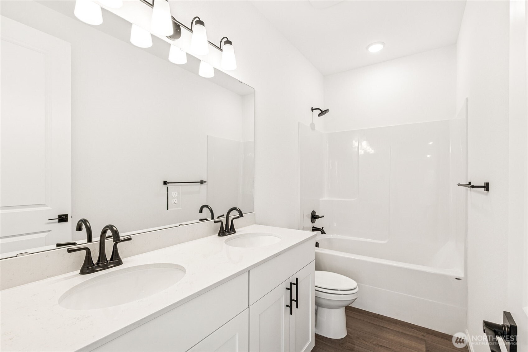 311 Crested Butte Boulevard, Unit 47 Mount Vernon, WA 98273 - Photo 11 of 13 a bathroom with a sink a toilet and a mirror