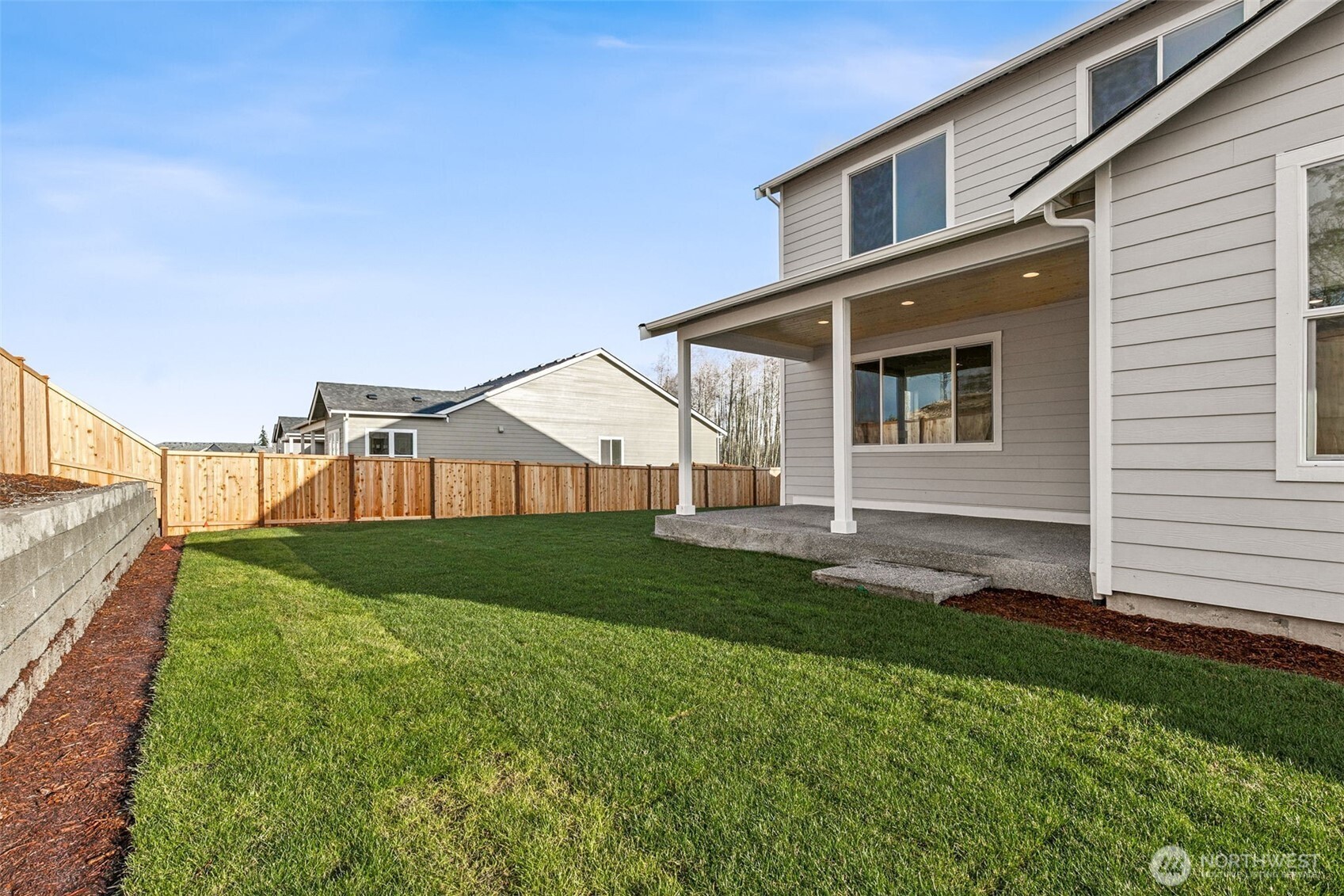 311 Crested Butte Boulevard, Unit 47 Mount Vernon, WA 98273 - Photo 12 of 13 a front view of a house with garden