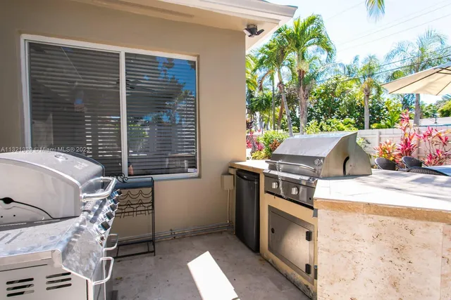 a view of a patio with couches and potted plants