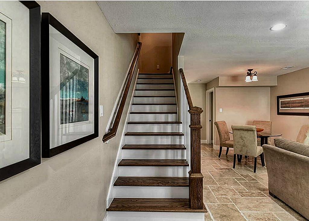 The view as you come in from the front door includes the wooden staircase with a beautiful banister.  The entry measure 3.5  x 8  It just feels like home right inside that front door!