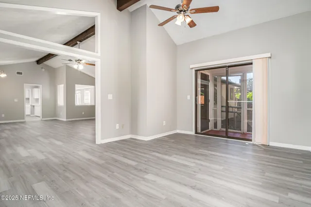 a view of an entryway with wooden floor