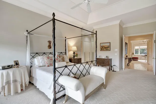 a living room with couch and a floor to ceiling window