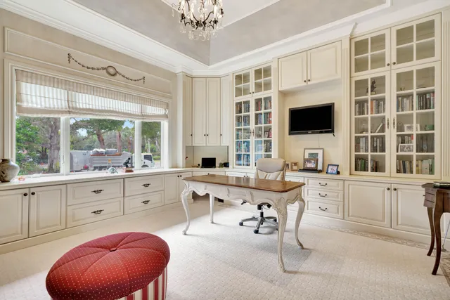 a bedroom with a bed and a chair