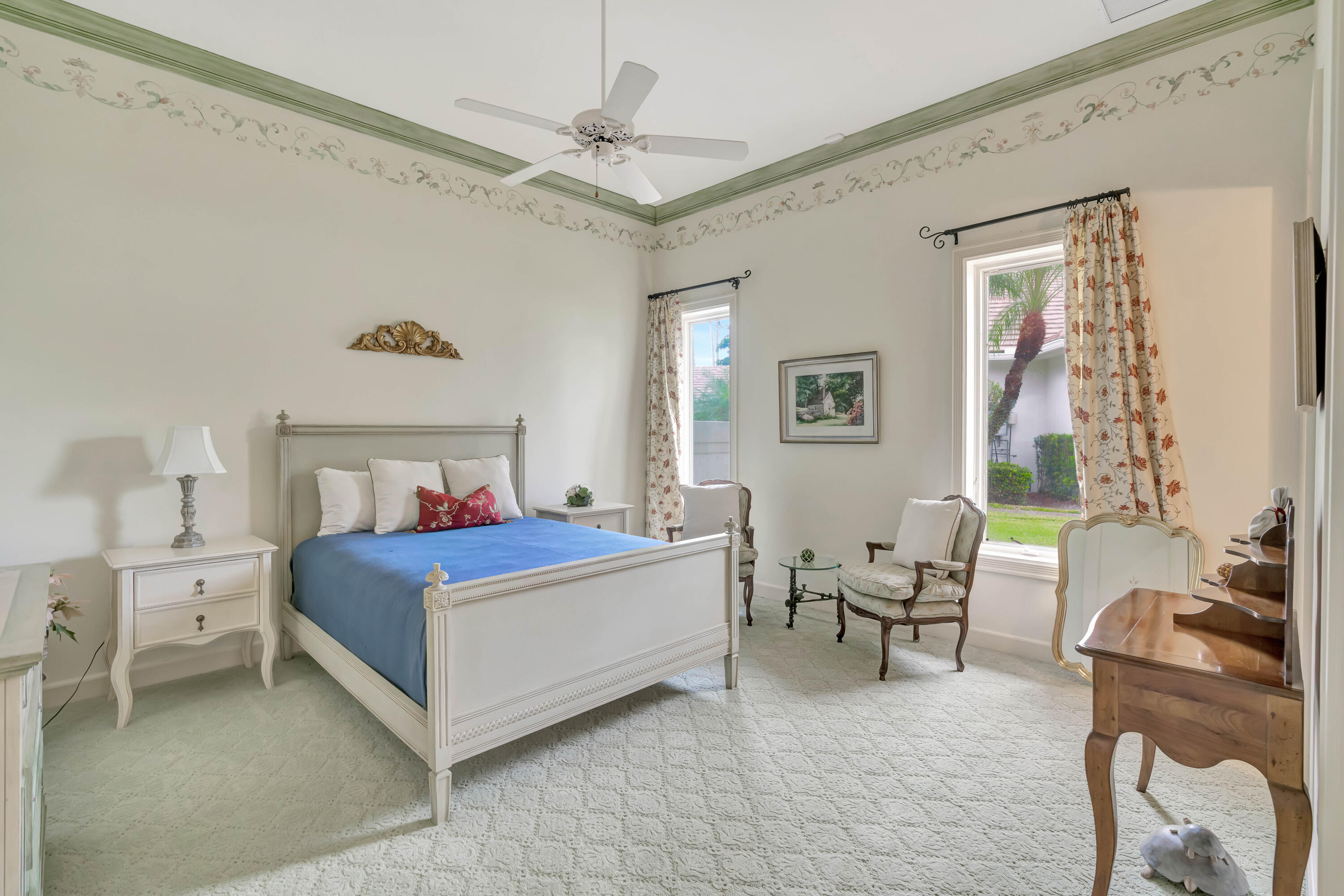 266 Locha Drive Jupiter, FL 33458 - Photo 28 of 60 a bedroom with a bed and a chair