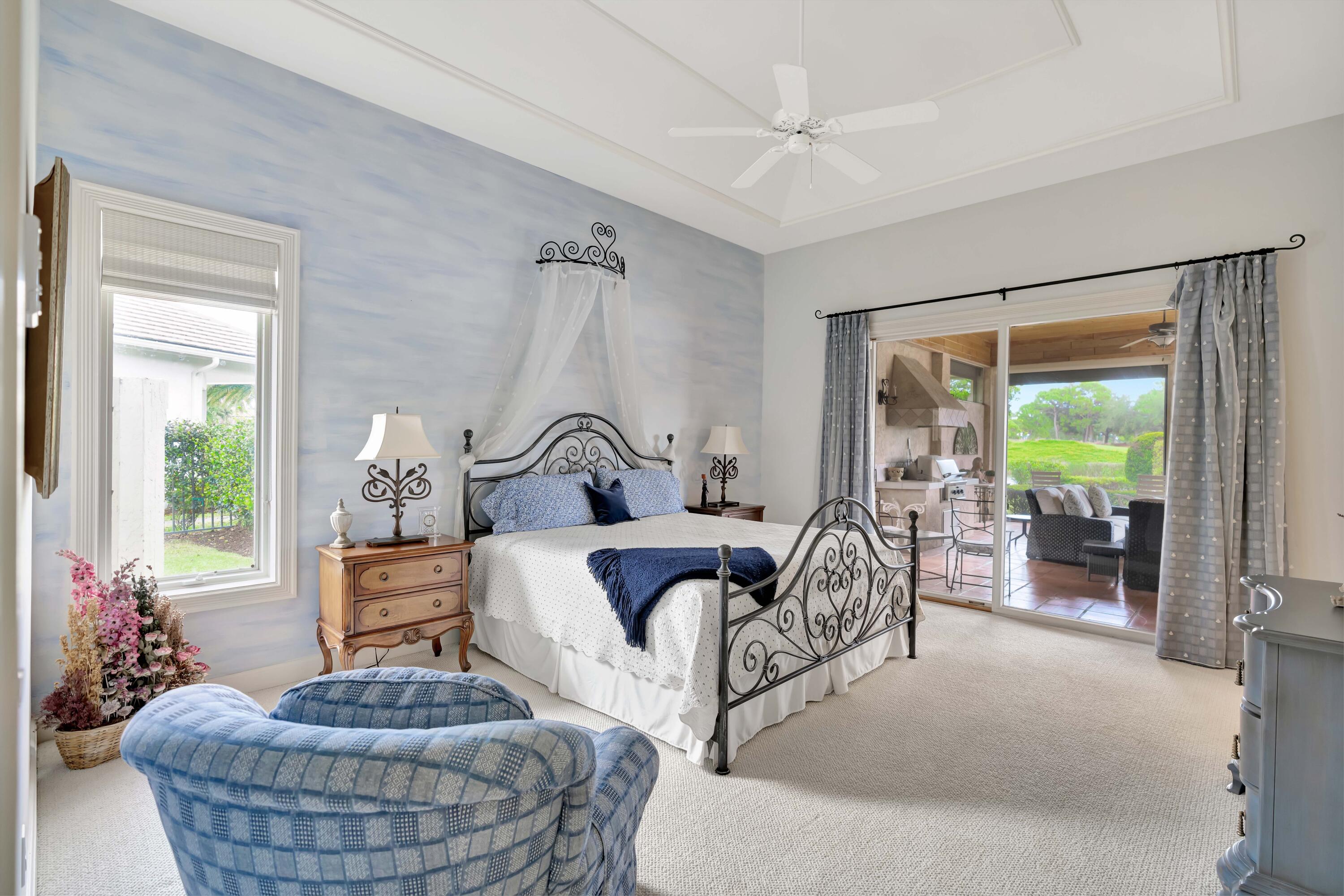 266 Locha Drive Jupiter, FL 33458 - Photo 30 of 60 a living room with furniture and a large window