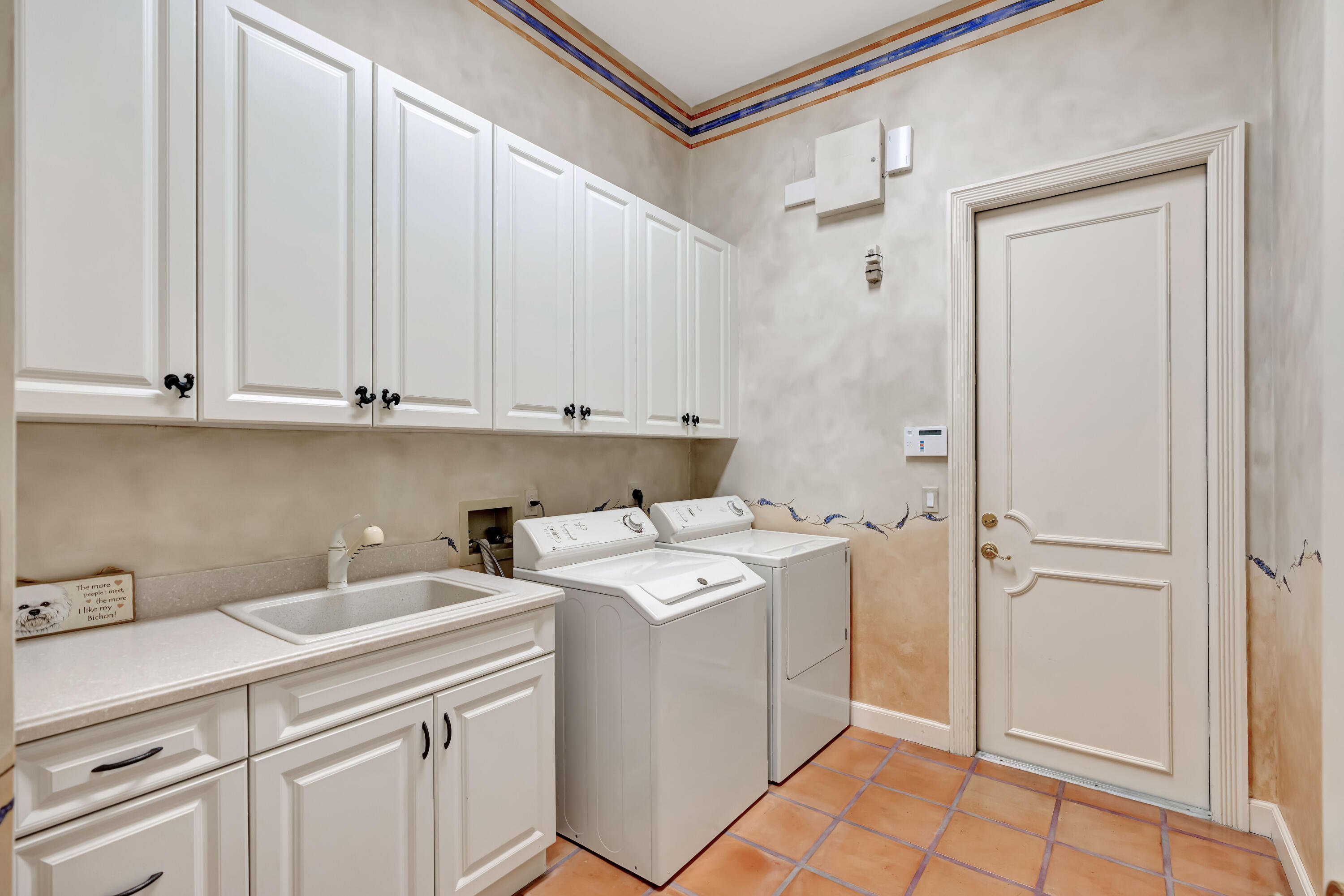 266 Locha Drive Jupiter, FL 33458 - Photo 34 of 60 a utility room with dryer and washer